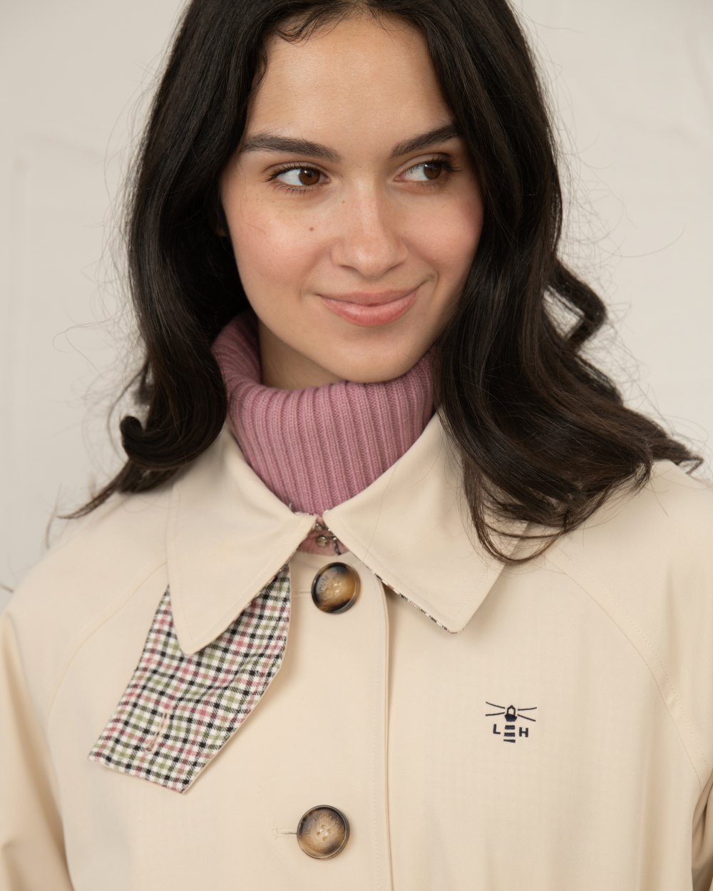 Stone coloured Lighthouse Ladies Harper Waterproof Trench Coat on wall background 
