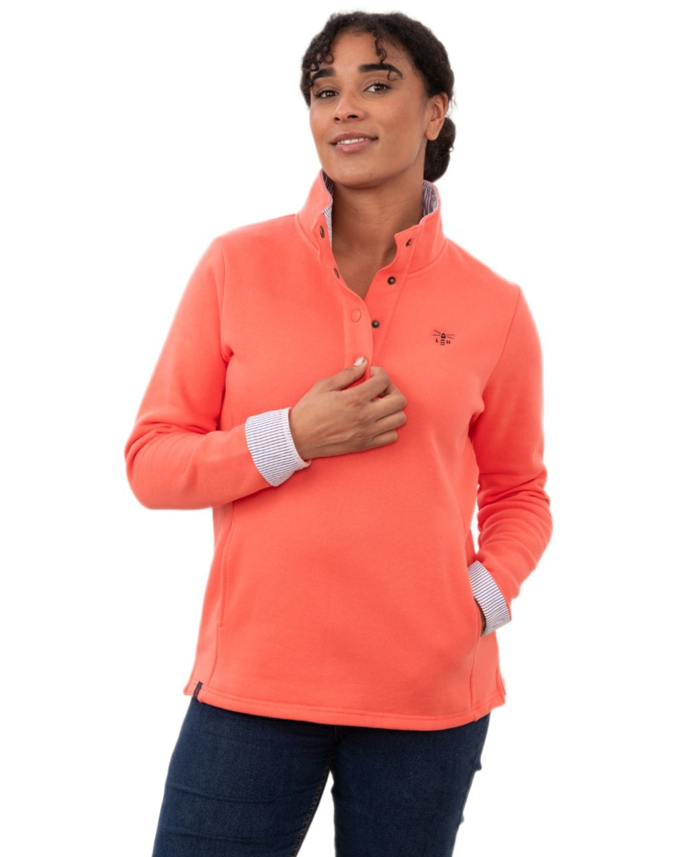Coral coloured Lighthouse Ladies Haven II Jersey on white background 