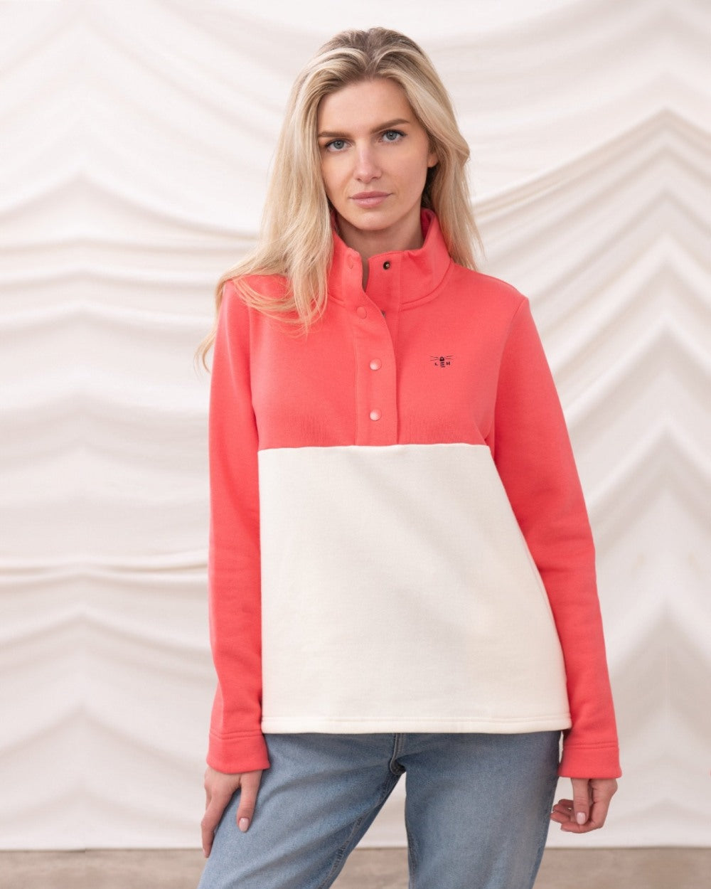 Coconut Deep Coral coloured Lighthouse Ladies Haven Jersey on curtain background 