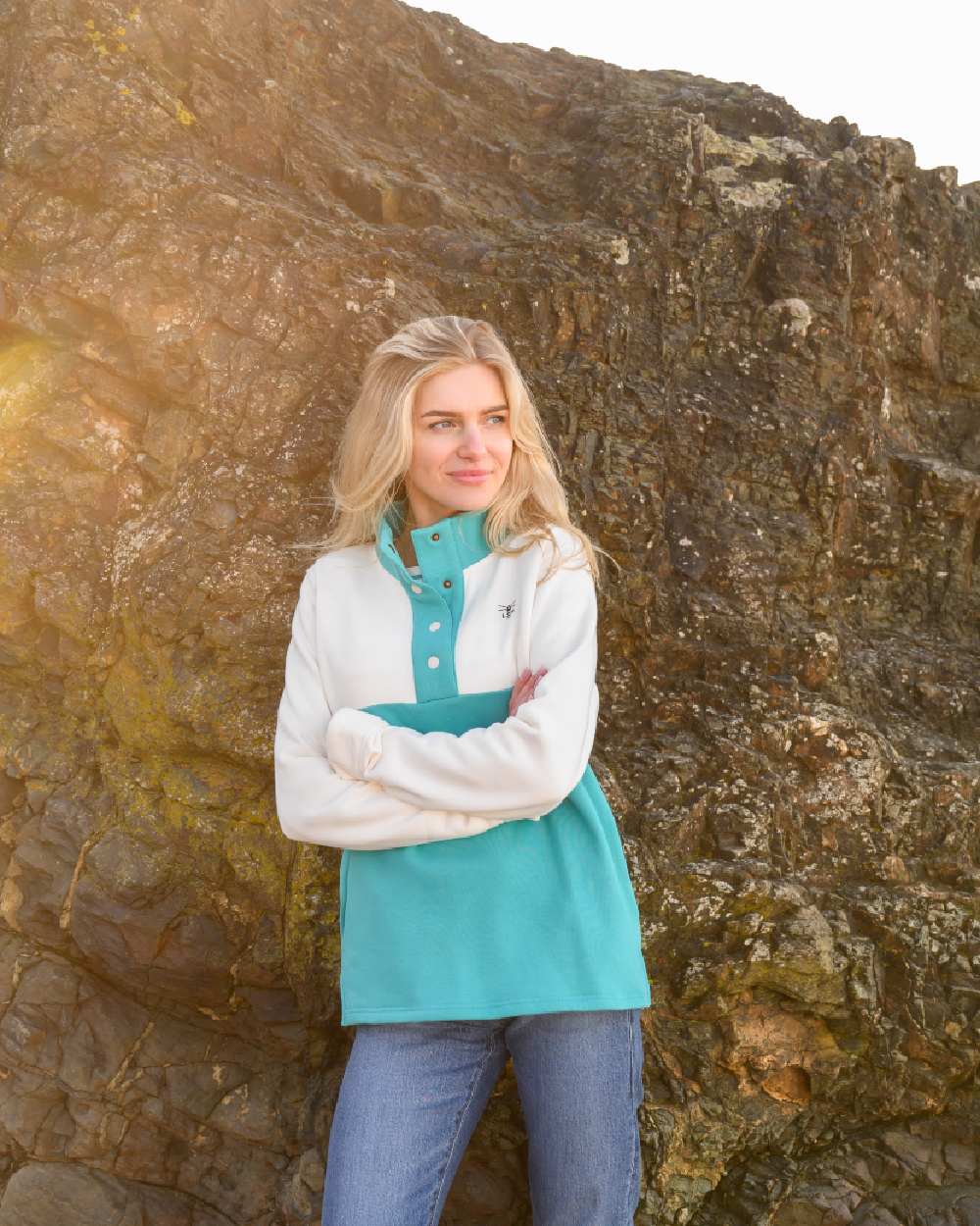 Coconut Soft Teal coloured Lighthouse Ladies Haven Jersey on rock background 