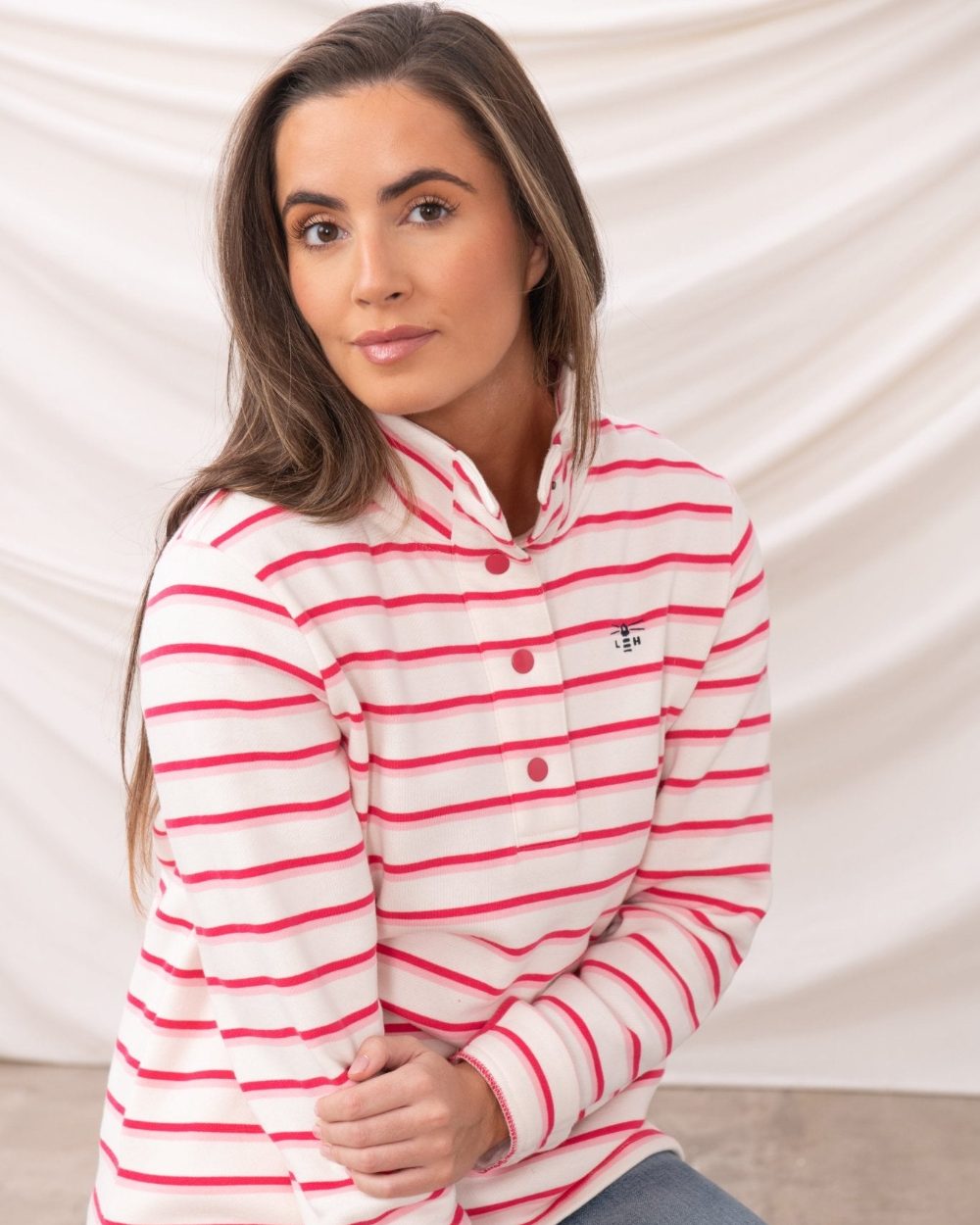 Pink Stripe coloured Lighthouse Ladies Haven Jersey on curtain background 