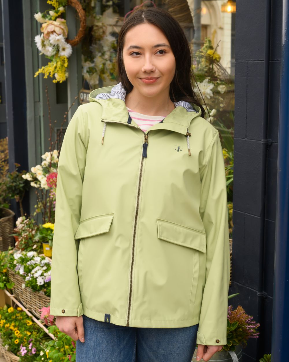Pistachio coloured Lighthouse Ladies Lucy Jacket on floral background 