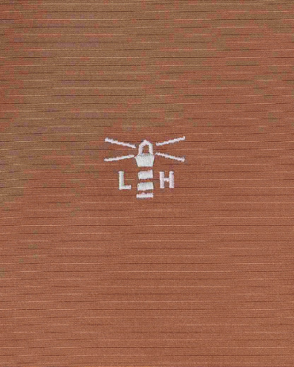 Rust coloured Lighthouse Ladies Scarlet Coat on white background 