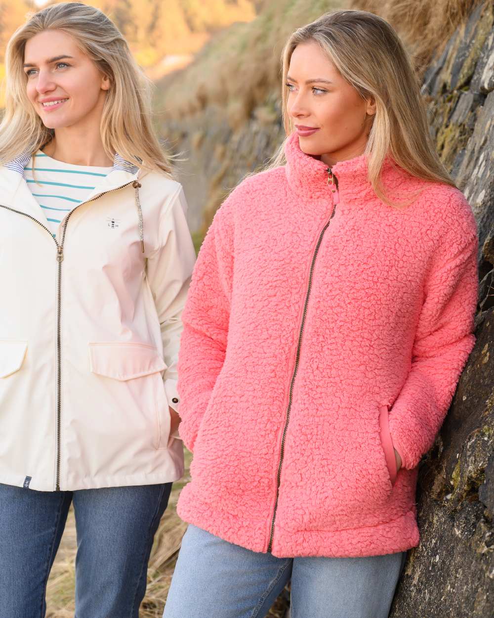 Sugar Coral coloured Lighthouse Ladies Seashell Full Zip Sherpa Fleece on rock background 
