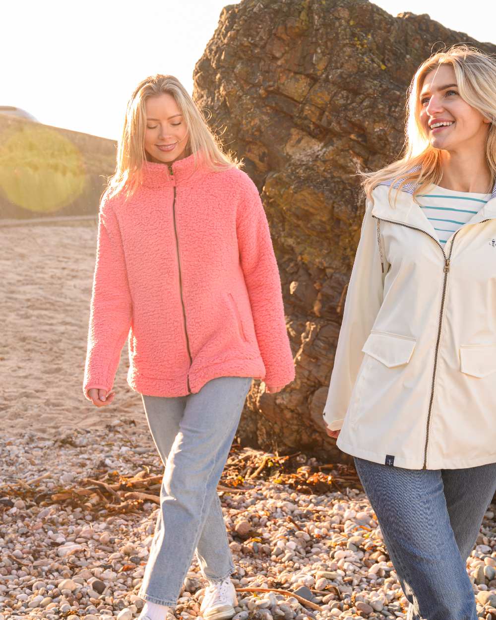 Sugar Coral coloured Lighthouse Ladies Seashell Full Zip Sherpa Fleece on rock background 