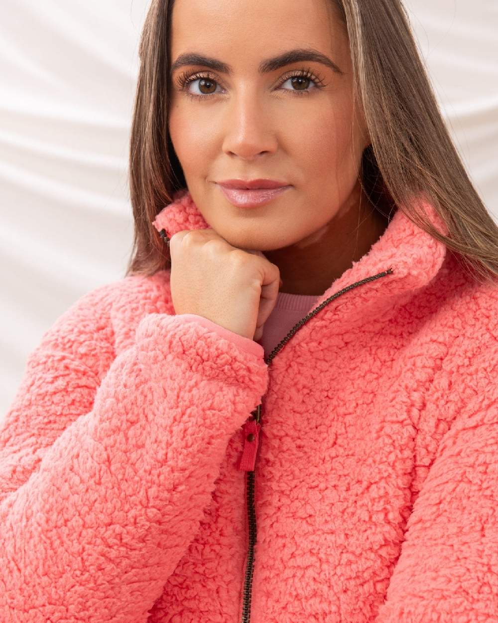 Sugar Coral coloured Lighthouse Ladies Seashell Full Zip Sherpa Fleece on curtain background 