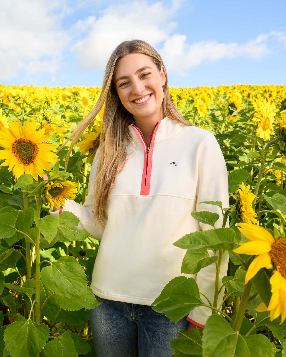 Coconut coloured Lighthouse Ladies Shore Sweatshirt on sunflower field background 
