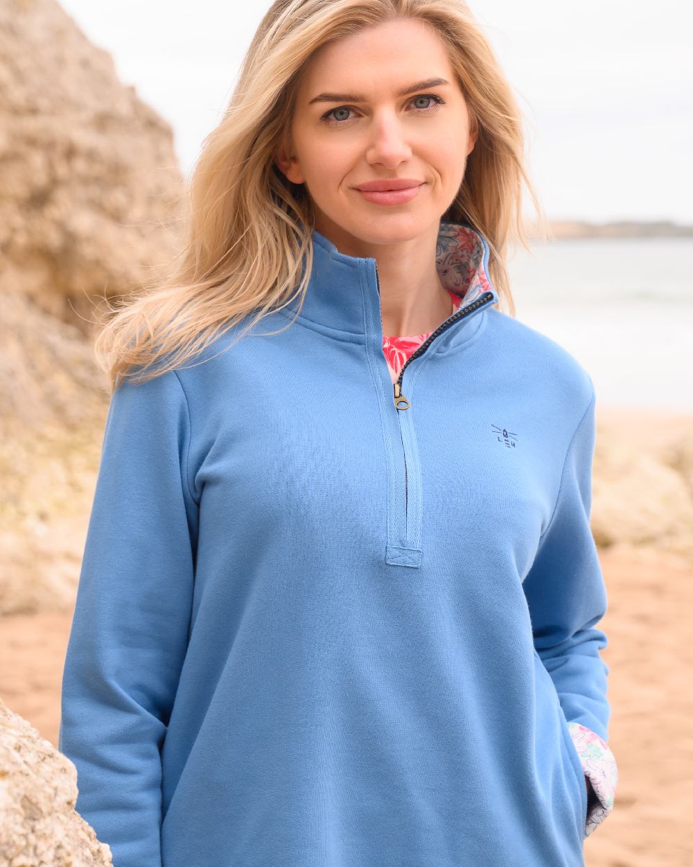 Marine Blue coloured Lighthouse Ladies Shore Sweatshirt on beach background 