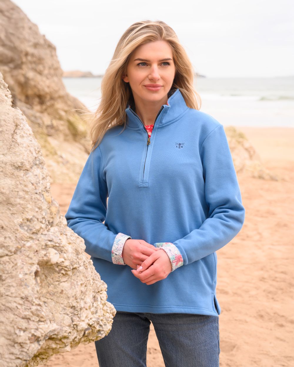 Marine Blue coloured Lighthouse Ladies Shore Sweatshirt on beach background 