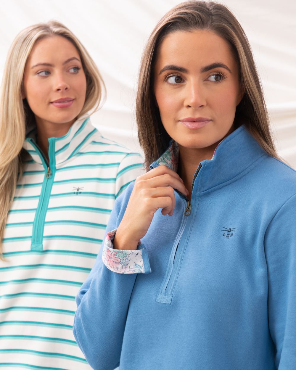 Marine Blue coloured Lighthouse Ladies Shore Sweatshirt on curtain background 