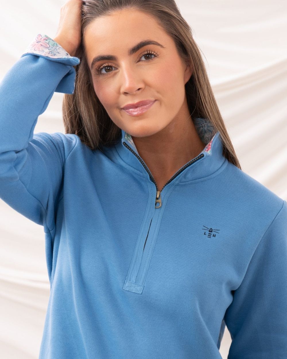 Marine Blue coloured Lighthouse Ladies Shore Sweatshirt on curtain background 