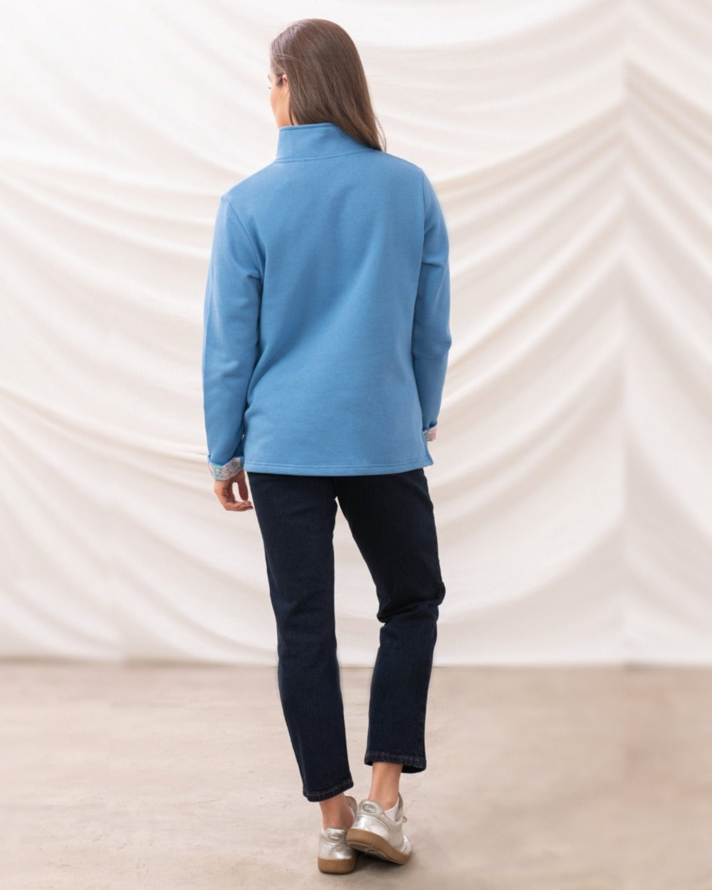 Marine Blue coloured Lighthouse Ladies Shore Sweatshirt on curtain background 