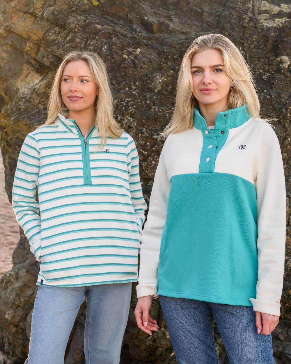 Soft Teal Stripe coloured Lighthouse Ladies Shore Sweatshirt on rock background 
