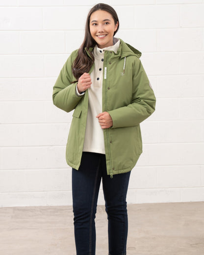 Sea Kelp coloured Lighthouse Ladies Tess Coat on wall background 