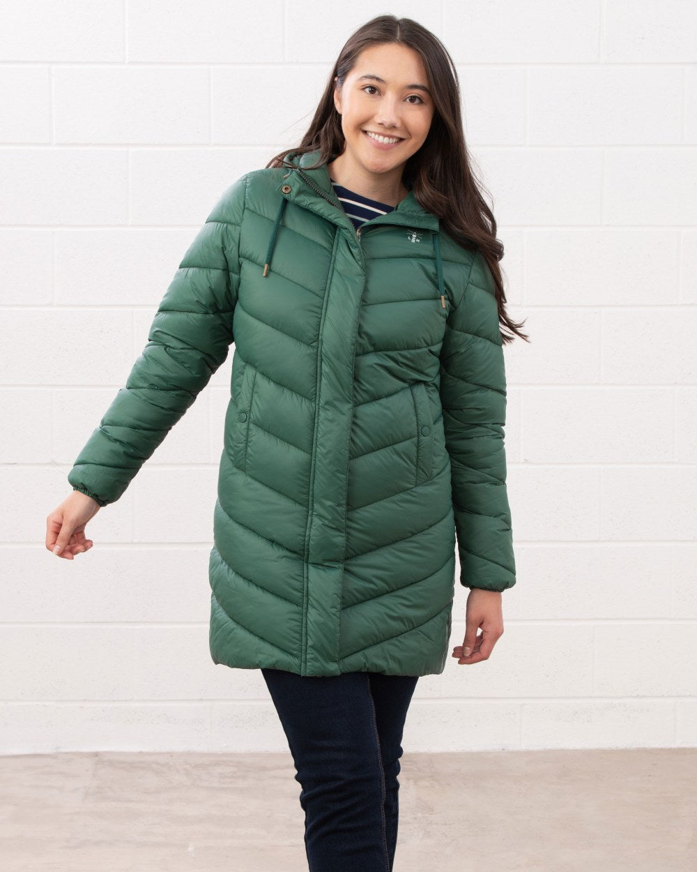 Kale coloured Lighthouse Laurel Ladies Coat on wall background 
