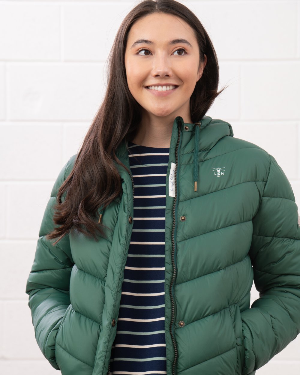 Kale coloured Lighthouse Laurel Ladies Coat on wall background 