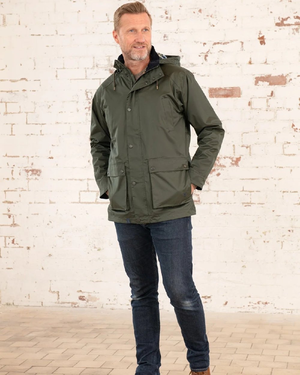 Hunter Green Coloured Lighthouse Mens Oxford Raincoat on wall background 