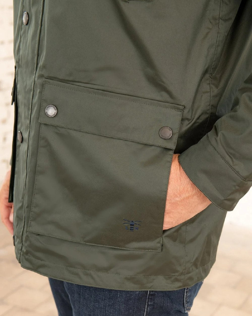 Hunter Green Coloured Lighthouse Mens Oxford Raincoat on wall background 
