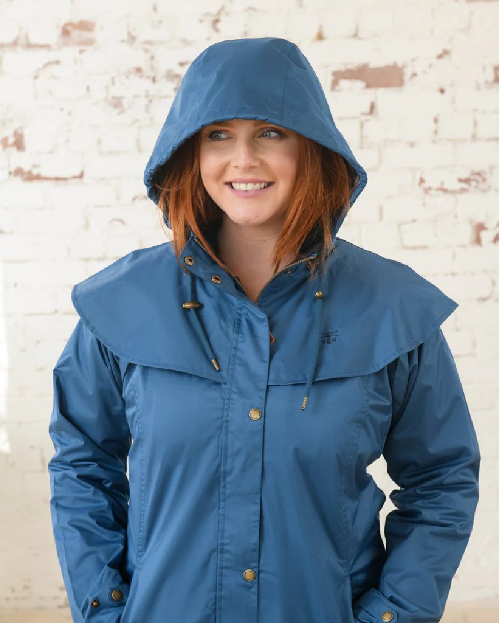 Deep Sea coloured Lighthouse Outrider 3-4 Length Ladies Waterproof Raincoat - Clearance Colours on wall background 