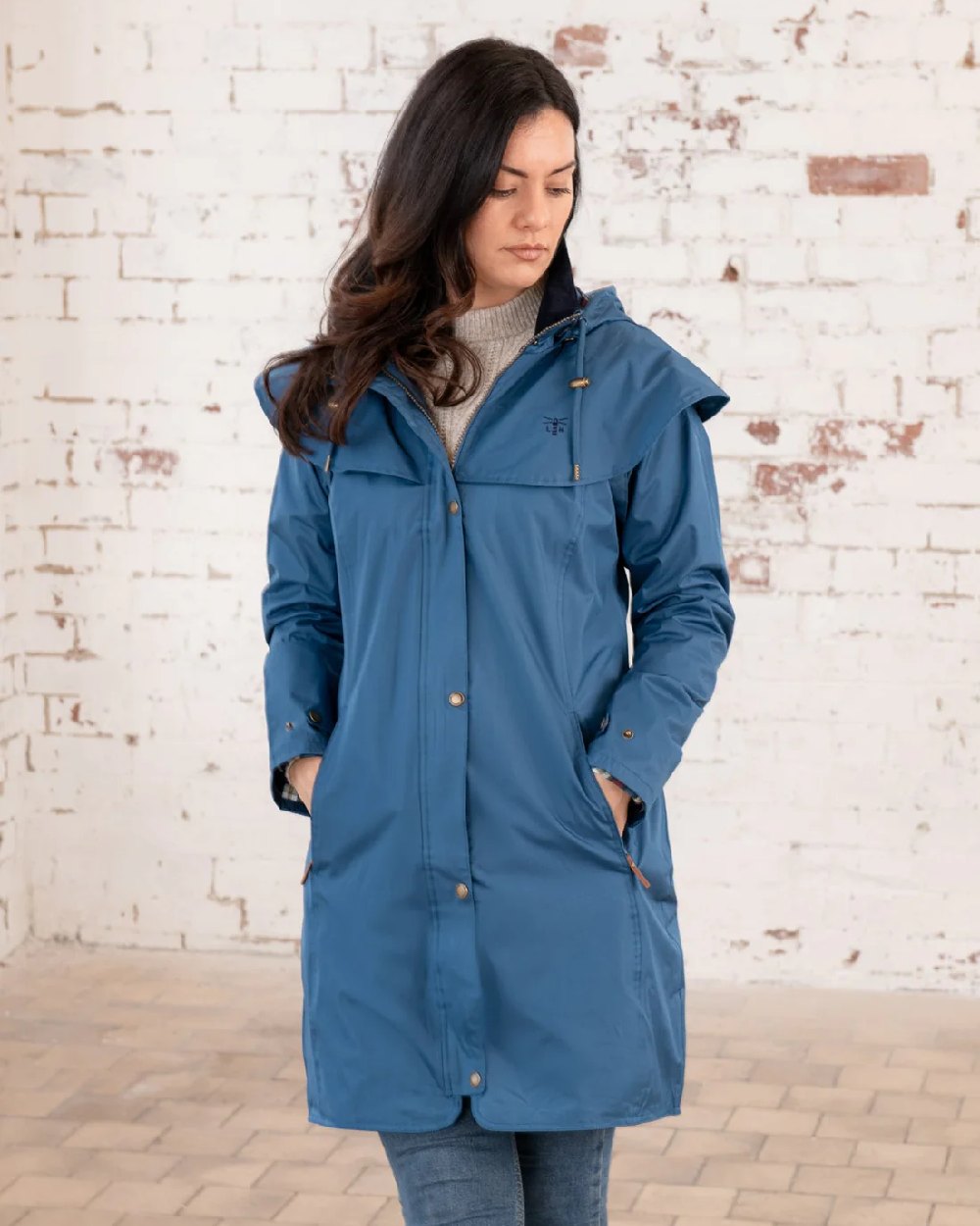 Deep Sea coloured Lighthouse Outrider 3-4 Length Ladies Waterproof Raincoat - Clearance Colours on wall background 