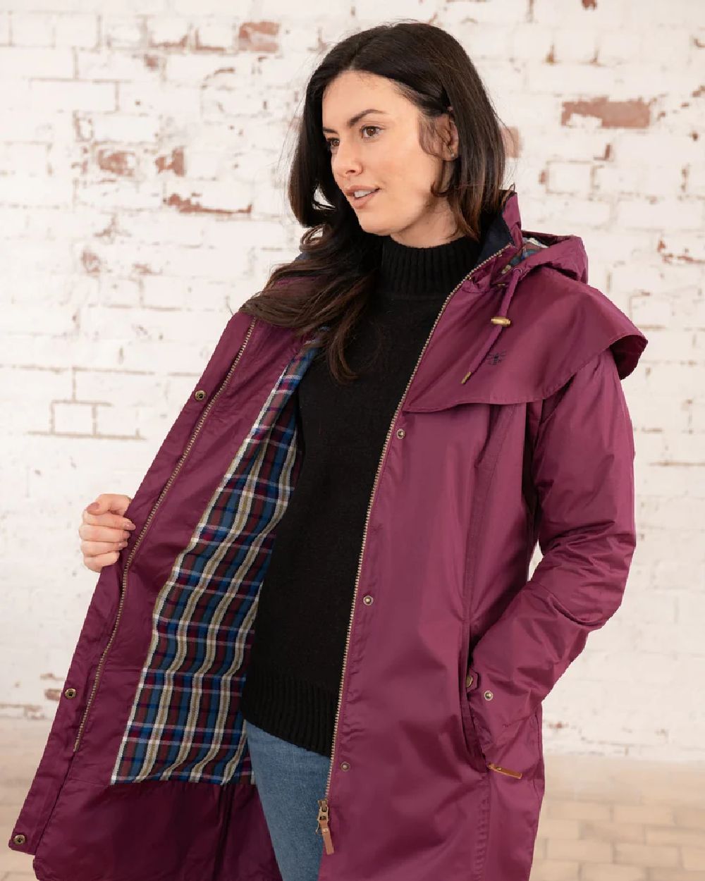 Plum coloured Lighthouse Outrider 3-4 Length Ladies Waterproof Raincoat - Clearance Colours on wall background 