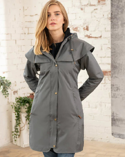 Urban Grey coloured Lighthouse Outrider 3/4 Length Ladies Waterproof Raincoat on wall background 