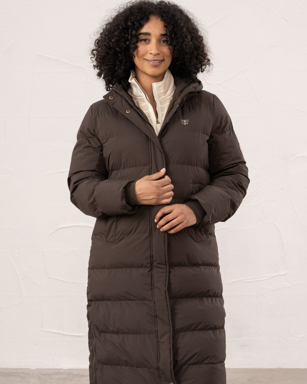 Cocoa coloured Lighthouse Savannah Coat on wall background 