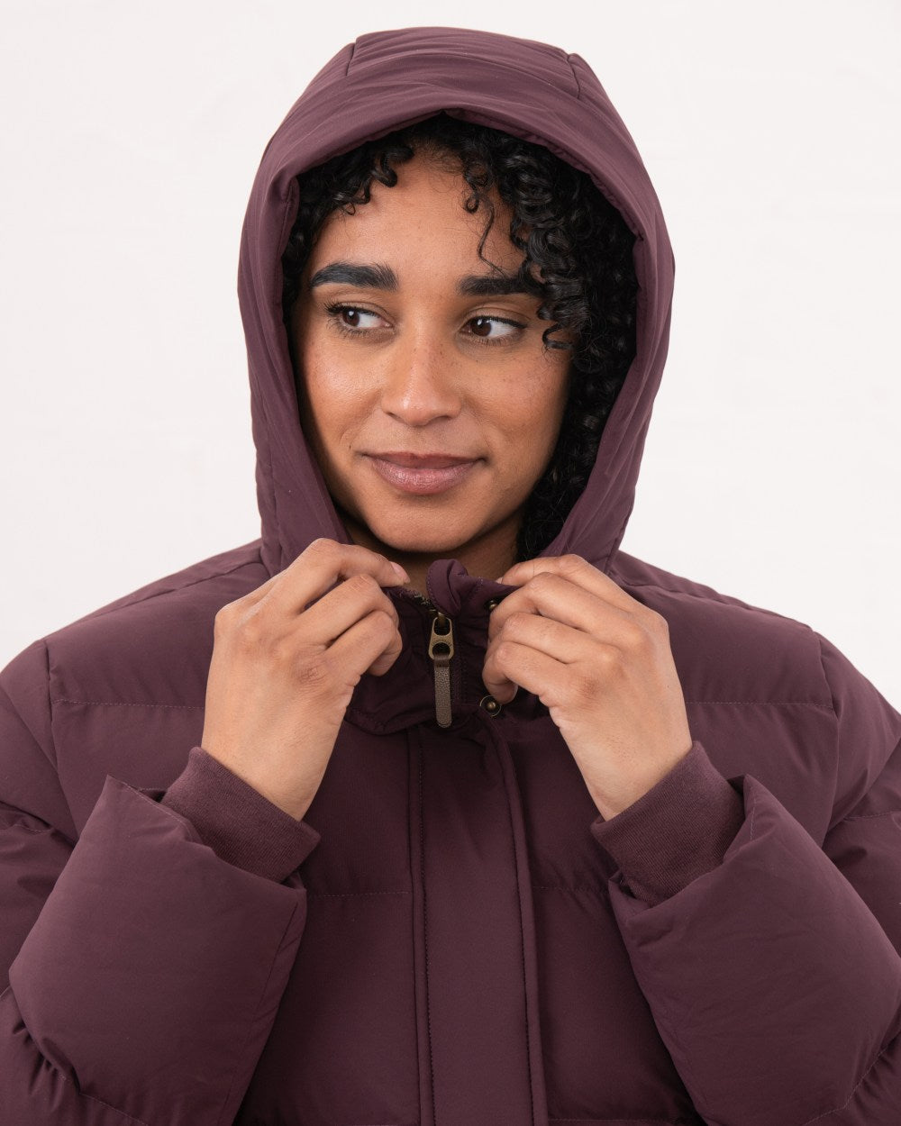 Damson coloured Lighthouse Savannah Coat on wall background 