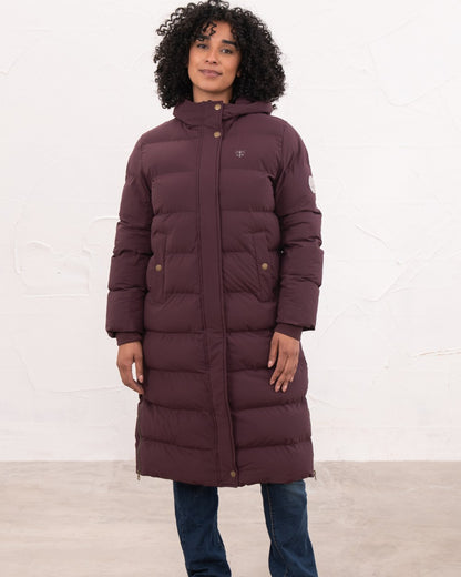 Damson coloured Lighthouse Savannah Coat on wall background 