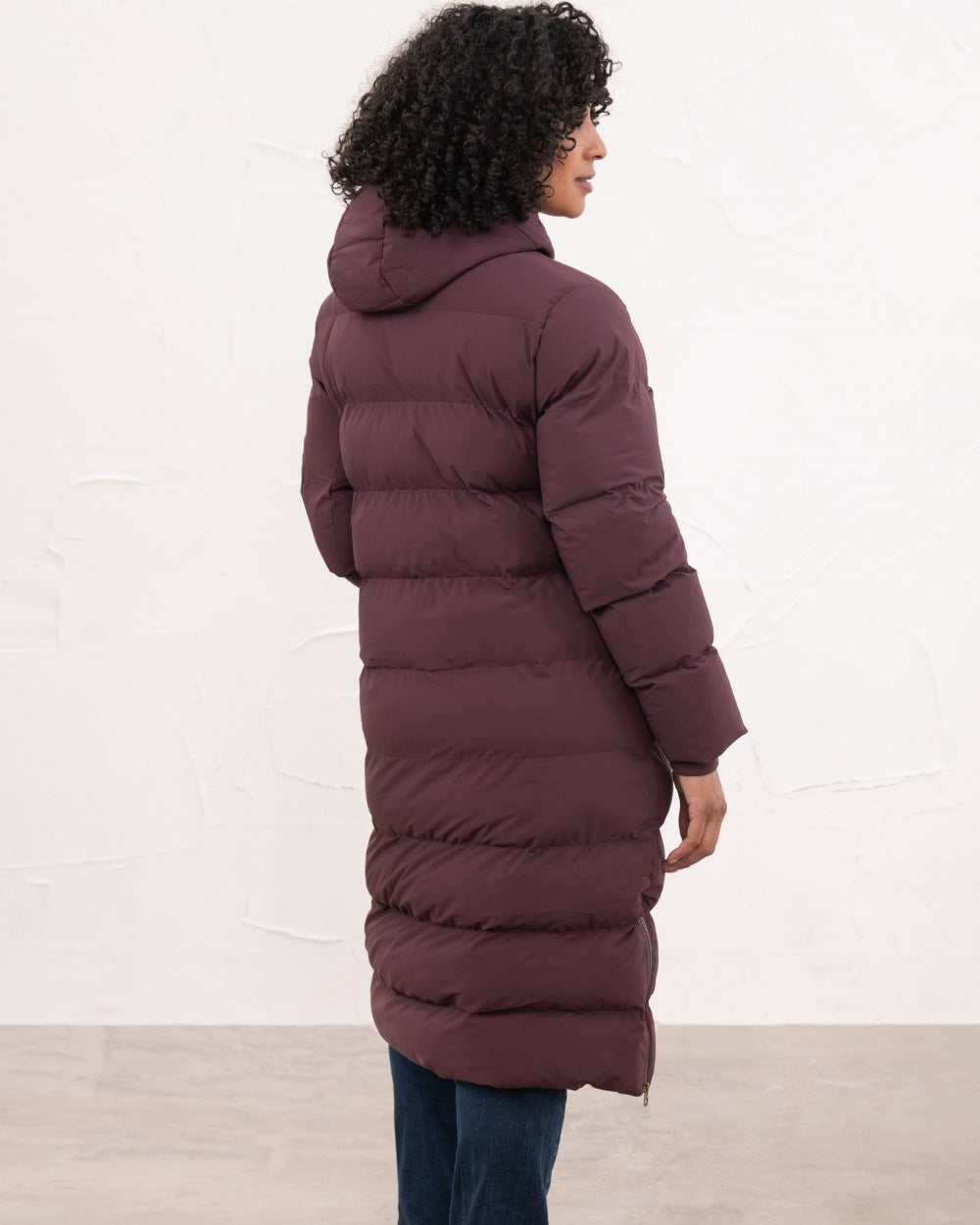 Damson coloured Lighthouse Savannah Coat on wall background 