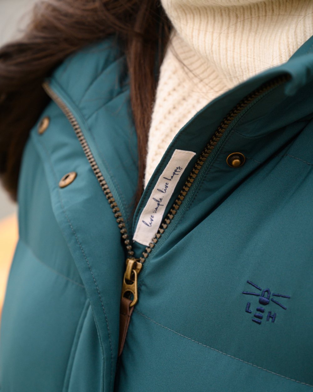 Pine coloured Lighthouse Savannah Coat on beach background 
