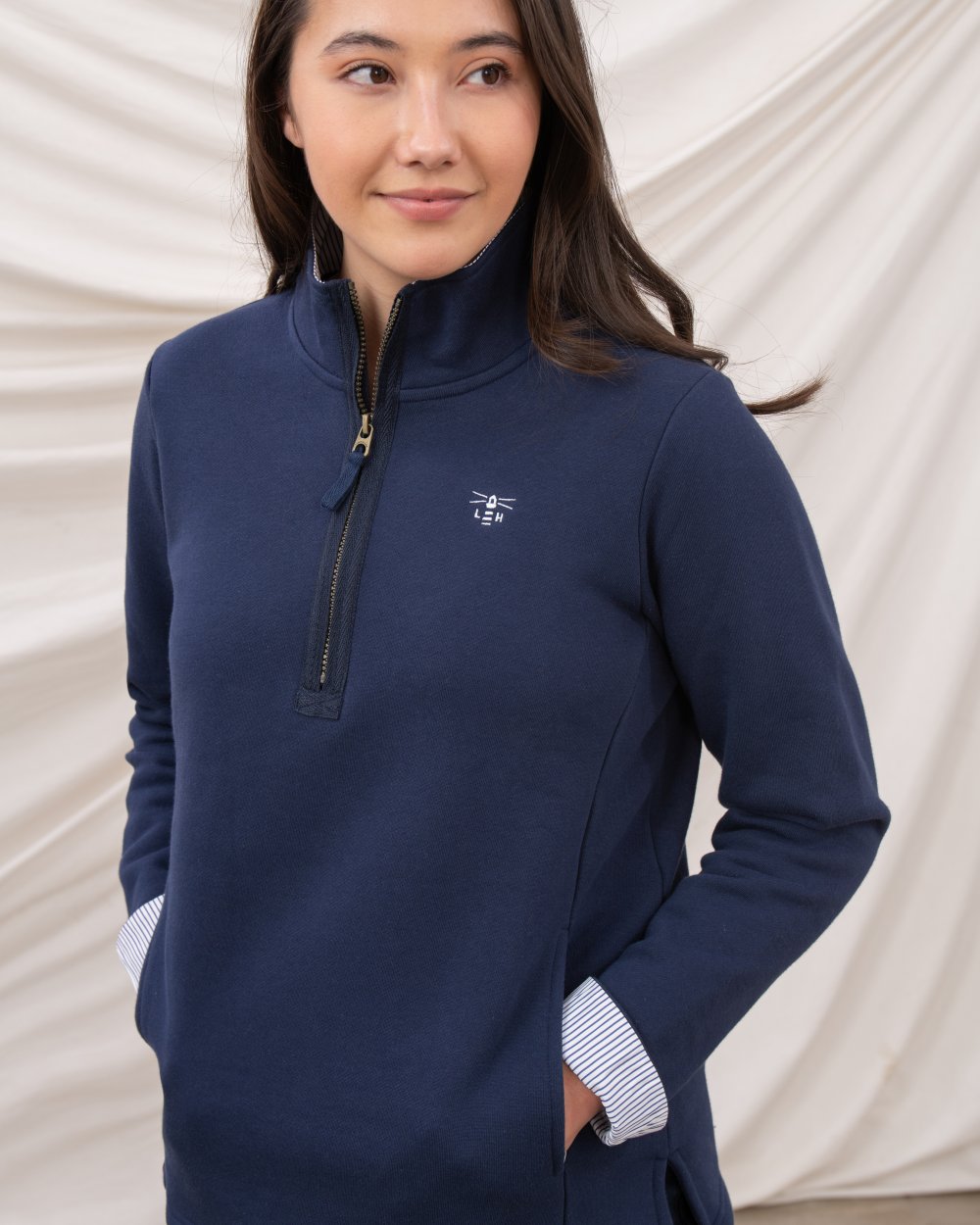 Navy coloured Lighthouse Shore Jersey Top on curtain background 