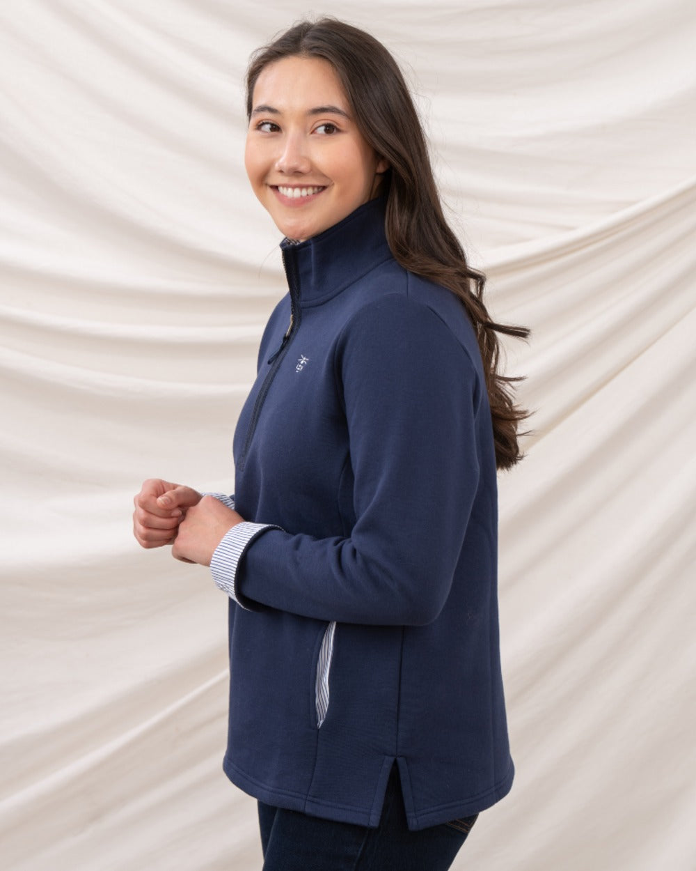 Navy coloured Lighthouse Shore Jersey Top on curtain background 