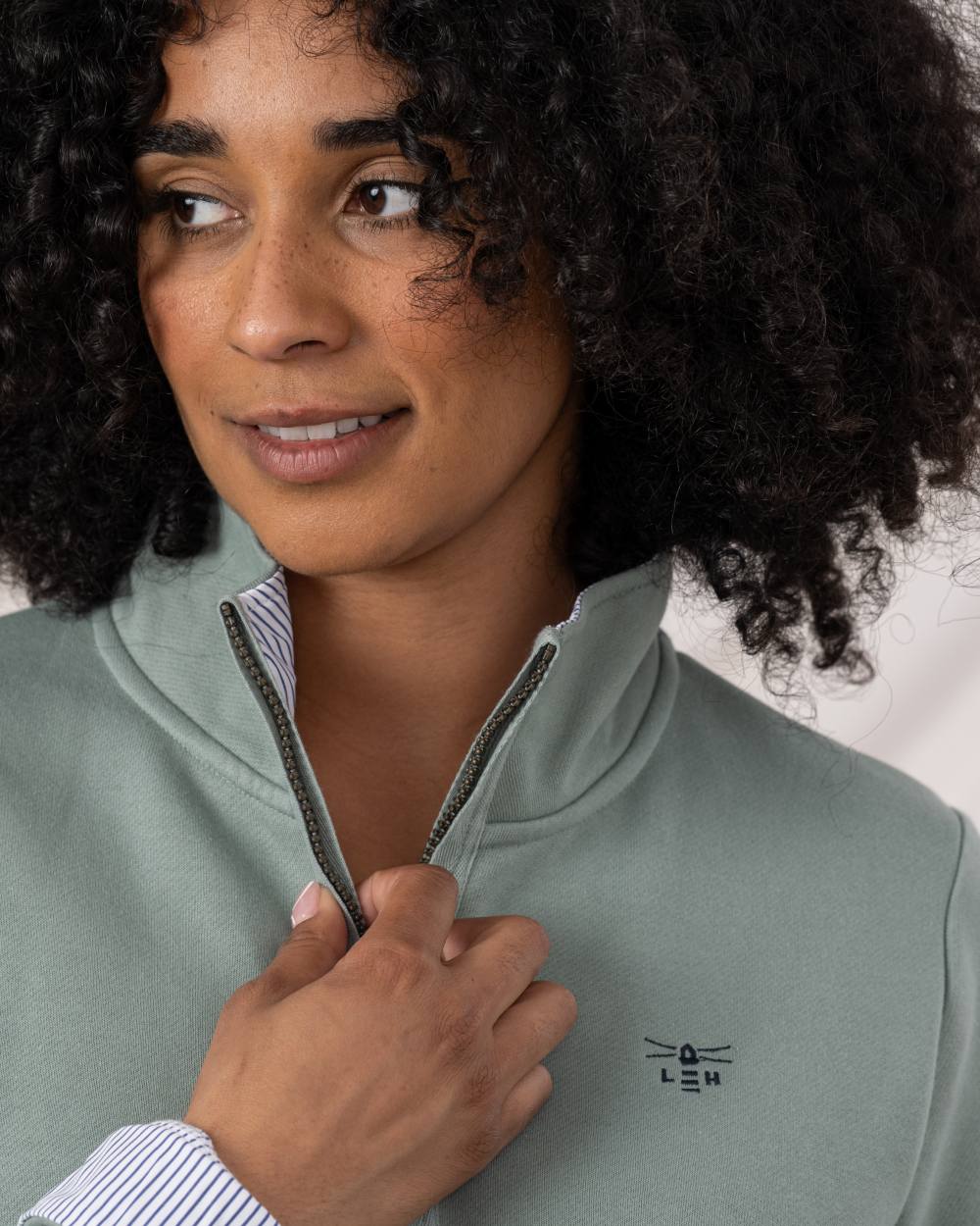 Sage coloured Lighthouse Shore Jersey Top on wall background 