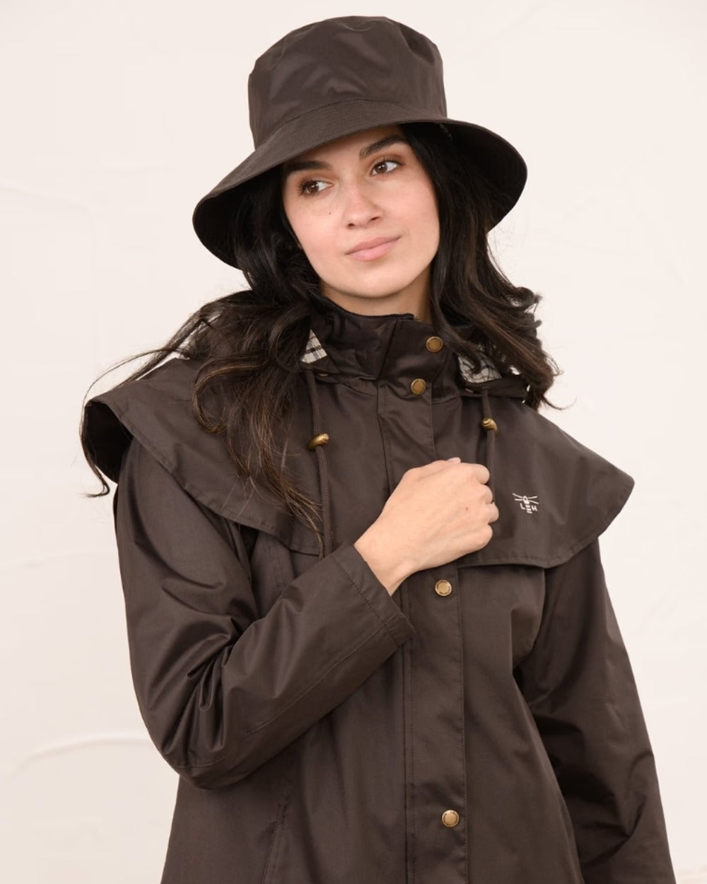 Chocolate coloured Lighthouse Storm Waterproof Hat on wall background 