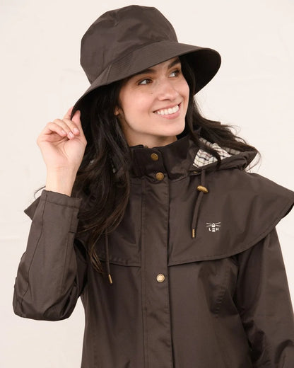 Chocolate coloured Lighthouse Storm Waterproof Hat on wall background 