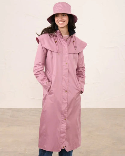 Wild Rose coloured Lighthouse Storm Waterproof Hat on wall background 