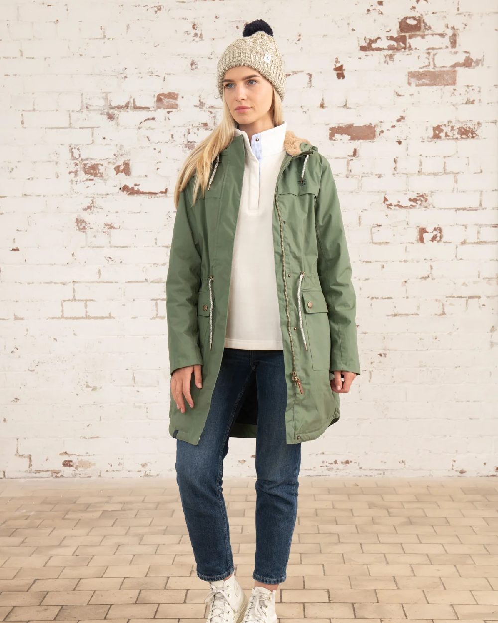 Khaki coloured Lighthouse Isobel Ladies Coat on wall background 