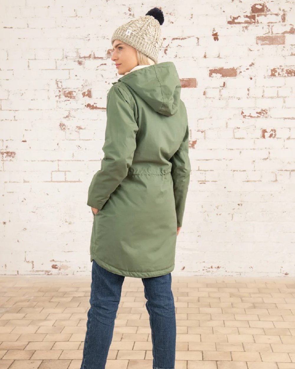 Khaki coloured Lighthouse Isobel Ladies Coat on wall background 