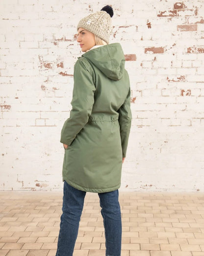 Khaki coloured Lighthouse Isobel Ladies Coat on wall background 