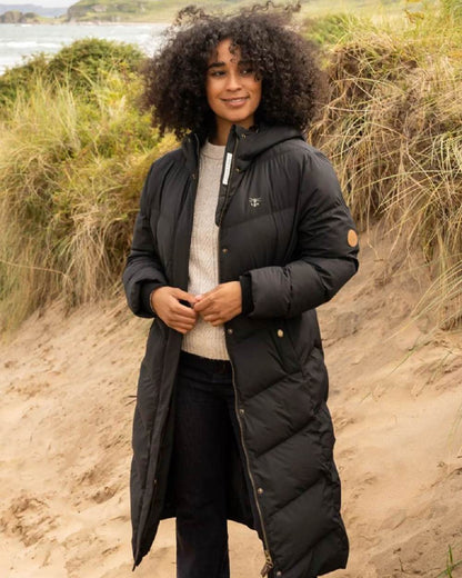 Black coloured Lighthouse Savannah Coat on beach background 