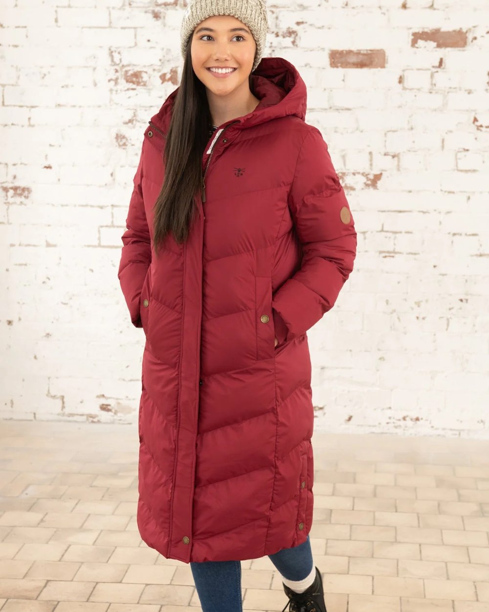Maroon coloured Lighthouse Savannah Coat on wall background 