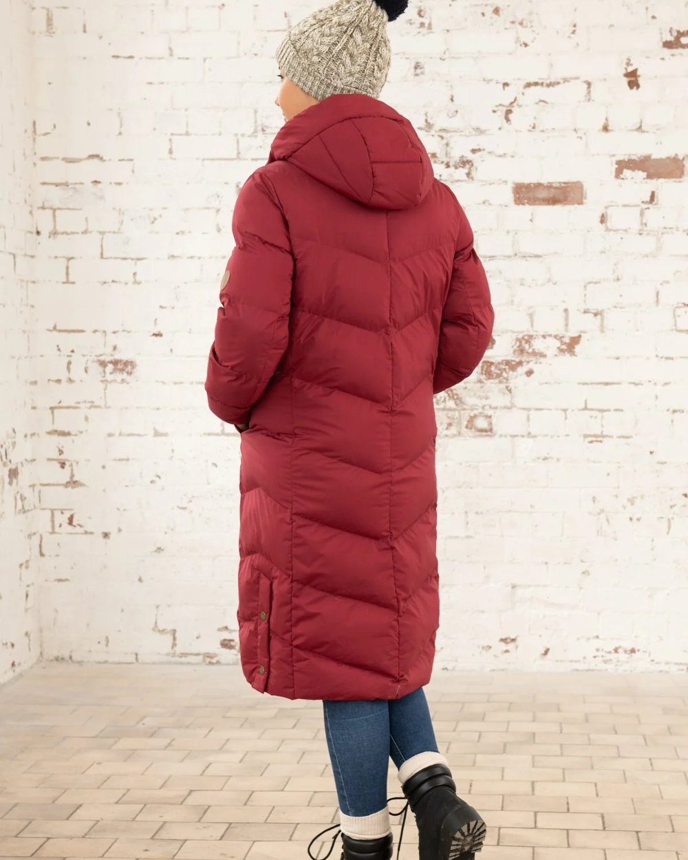 Maroon coloured Lighthouse Savannah Coat on wall background 