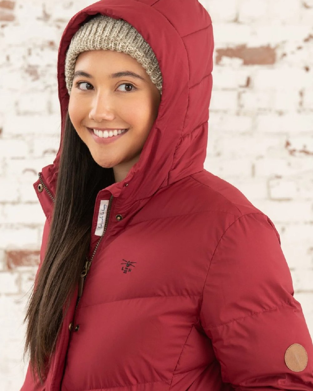 Maroon coloured Lighthouse Savannah Coat on wall background 