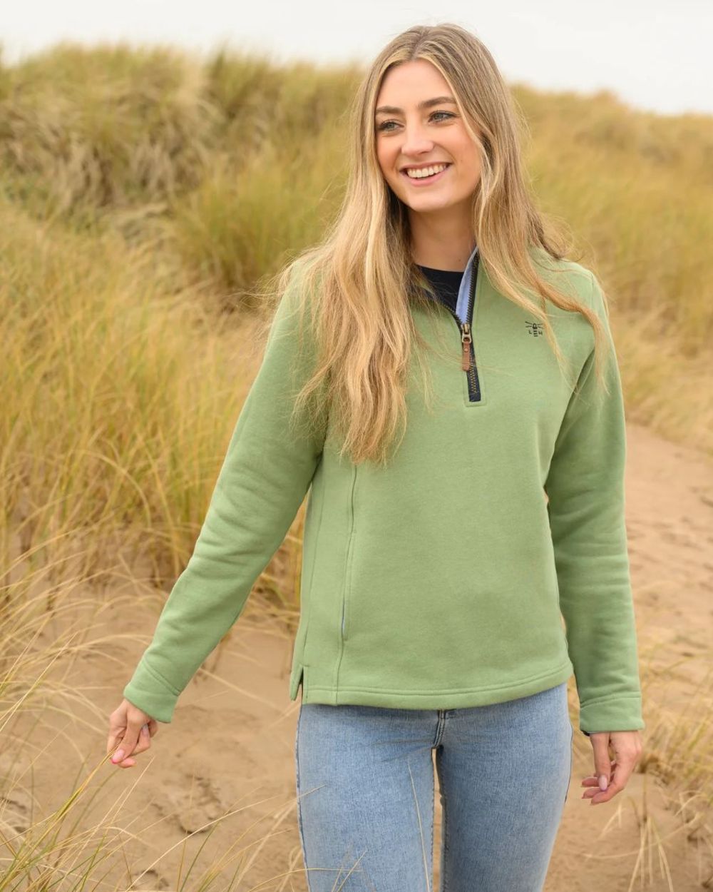 Pistachio coloured Lighthouse Shore Jersey Top on grassy background 