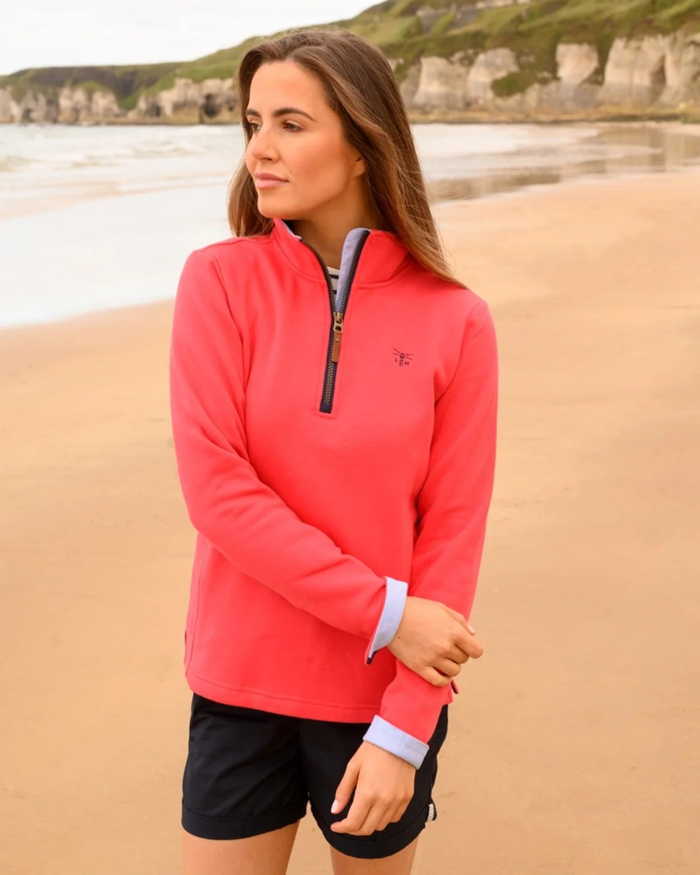 Watermelon coloured Lighthouse Shore Jersey Top on beach background 