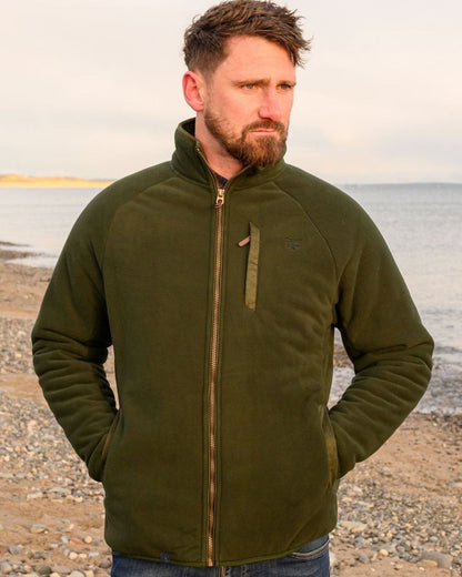 Hunter Green coloured Lighthouse Mens Windsor Waterproof Fleece Jacket on beach background 