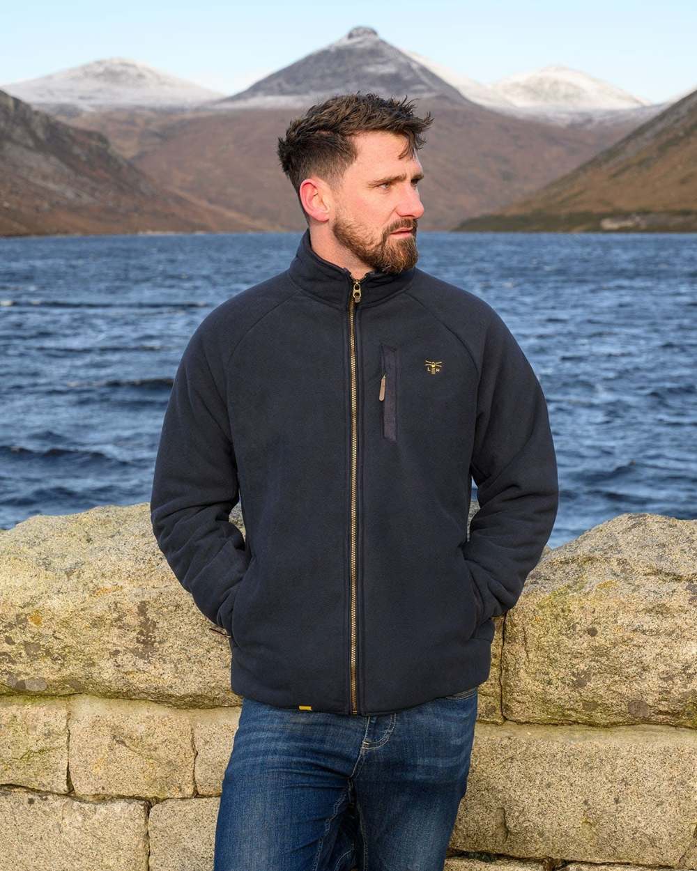 Navy coloured Lighthouse Mens Windsor Waterproof Fleece Jacket on beach background 