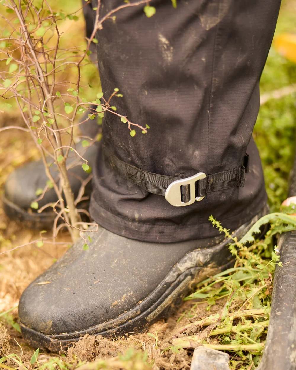 Black coloured Line 7 Womens Territory Storm Pro20 Waterproof Overtrouser on farm background 