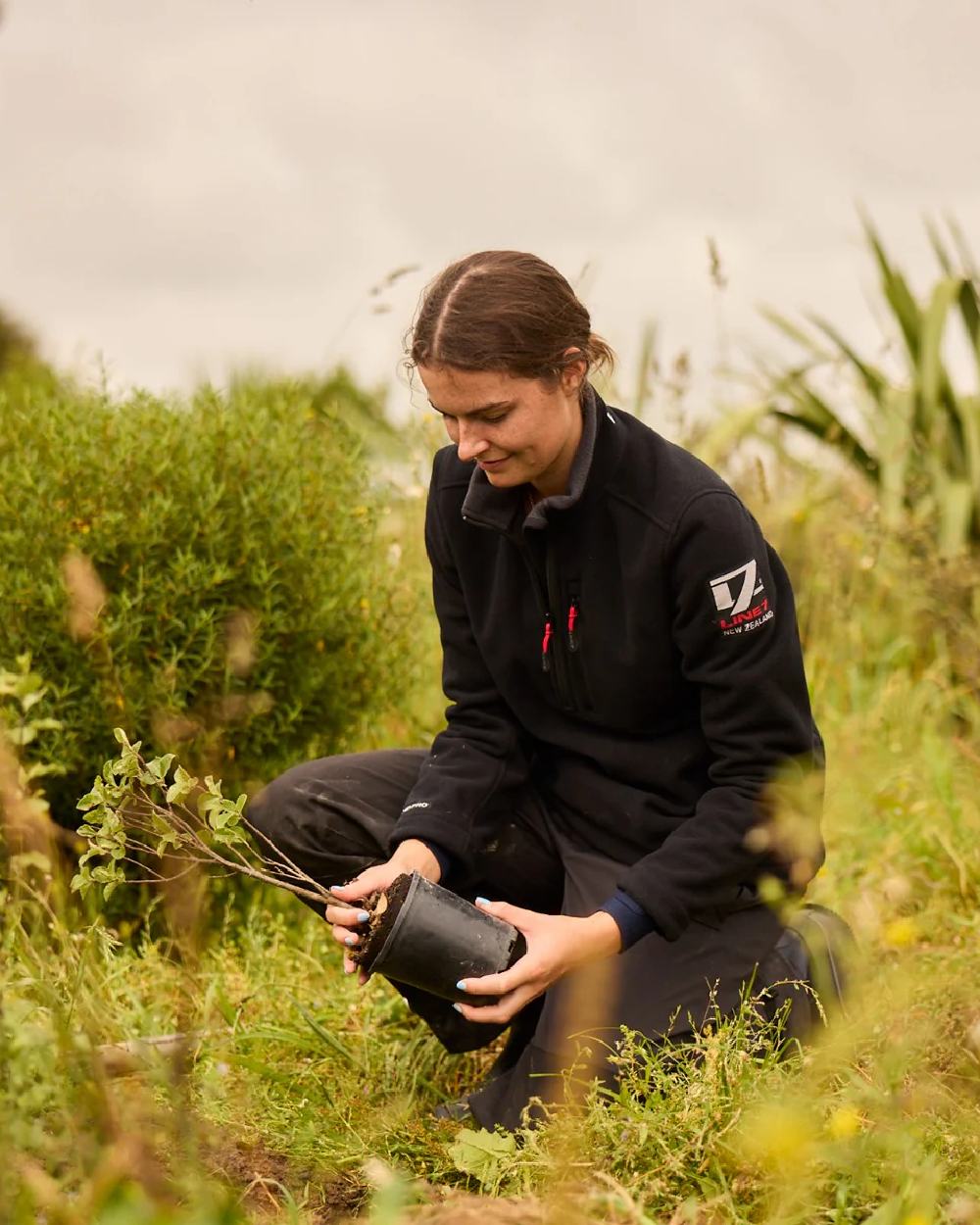 Black Coloured Line 7 Womens Territory Wind Pro Half Zip Fleece Jacket on forest background 